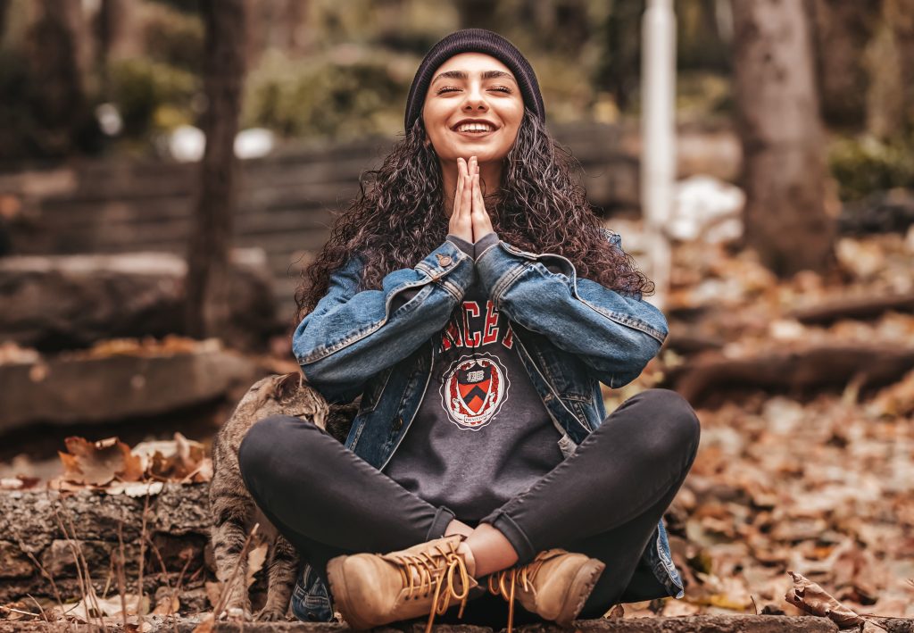 Woman using meditation to reduce stress levels. 